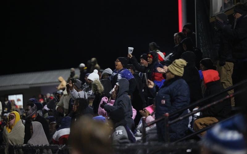 Elbert County’s fans cheer after a long run from quarterback Jayvyn Hickman during Elbert’s loss to Toombs County in the Elite-Eight round of the GHSA State Playoffs. (Photo by Wells)