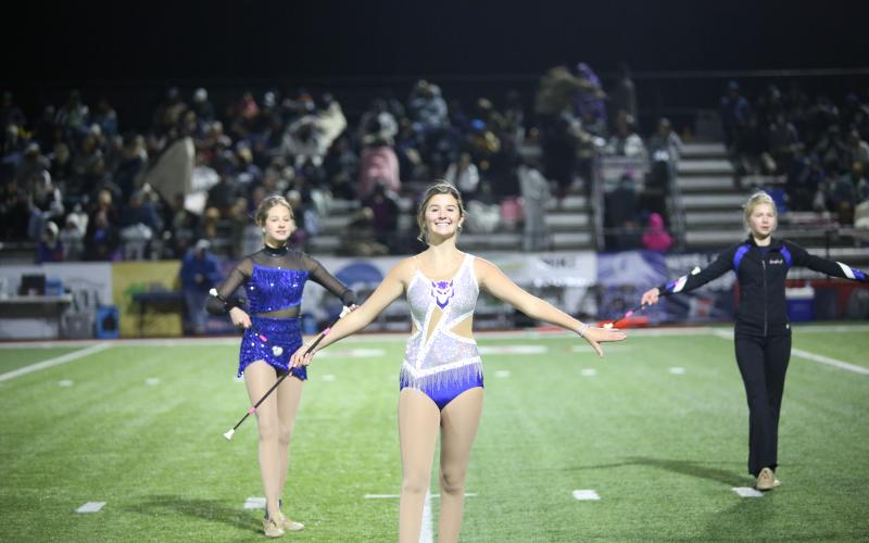 Lake Chandler leads the crowd in stands tunes during the Blue Devil Band’s halftime performance Nov. 29. (Photo by Wells)