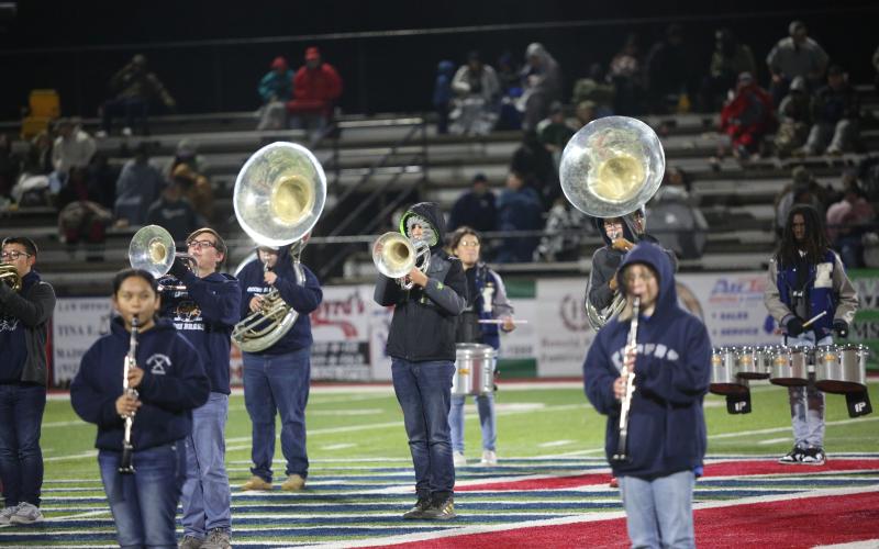 Eighth grader Gregory Floyd braves the cold weather as he performs with the Blue Devil band during halftime of the game against Toombs County Nov. 29. (Photo by Wells)