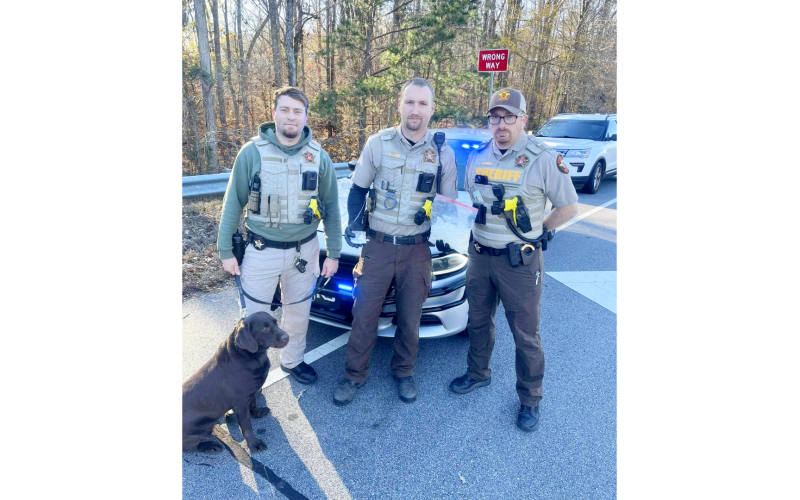 (L-R) K-9 handler Cpl. Jonathan Dove of the patrol division (with drug dog Baretta) and Lt. Clete Brady and Lt. Allen Frady of the Drug Investigations Unit display methamphetamine collected Dec. 12. (Photo submitted by Elbert County Sheriff's Office)