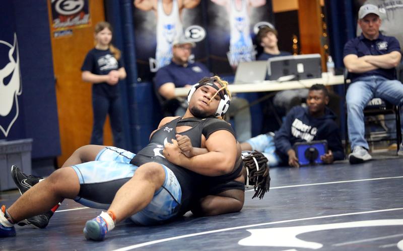 Senior M.J. Cook maneuvers around his opponent while fighting for leverage during the Inferno Invitational hosted by the Mat Devils in the Inferno Jan. 25. (Photo by Wells)