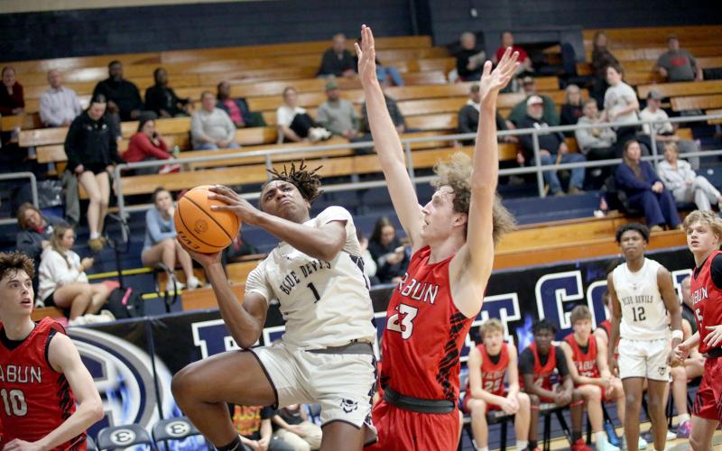 Dealyn Gray drives in from the wing and elevates to put the ball past a Rabun defender. (Photo by Wells)