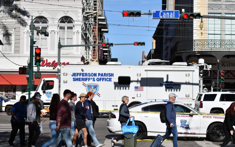 A Jefferson Parish Sheriff's Office emergency vehicle acts as a barrier at the Bourbon Street-Canal Street intersection to keep people away from the crime scene. (Photos by Wade Cheek/CNI News Service)