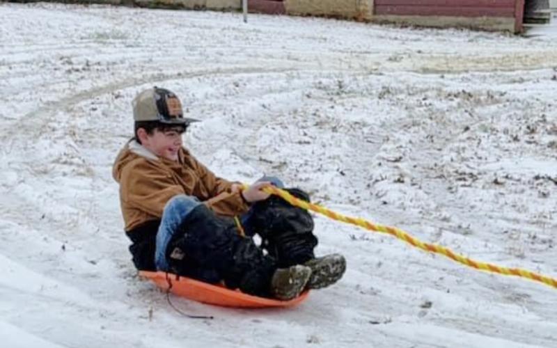 Lawson Henry enjoyed being pulled on his sled. (Photo submitted by Briana Armour)