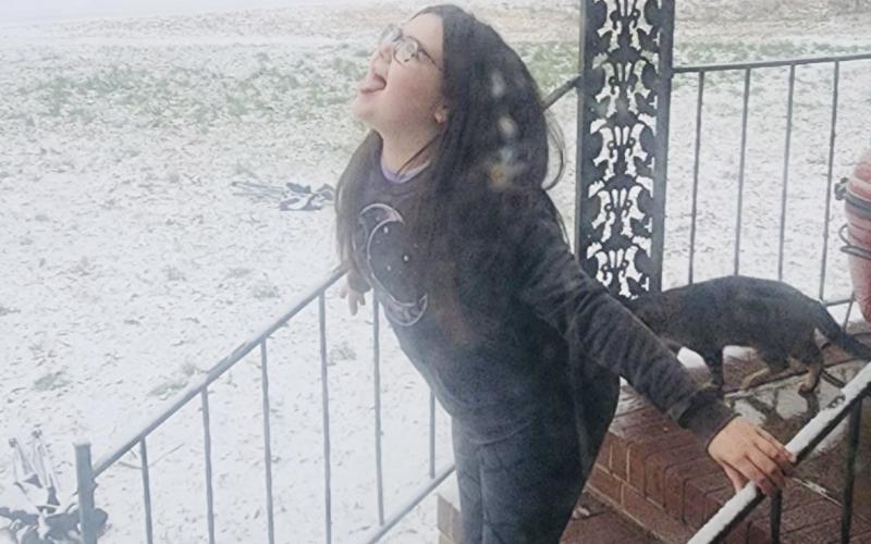 Teegan Duke tries to catch snowflakes in Bowman. (Photo submitted by Shanna Duke)