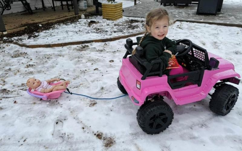Kate Duncan pulls her doll in a sled. (Photo submitted by Bailey Webb)