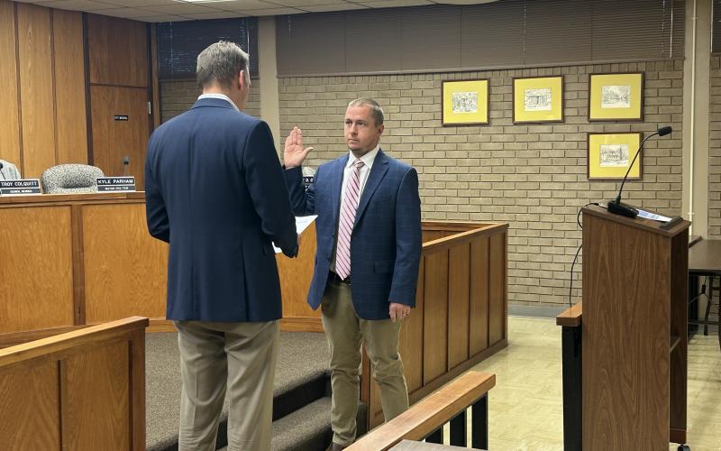 Elberton Mayor Daniel Graves (left) swears in city council member Kyle Parham  (right) as the 2025 Mayor Pro Tempore during the Jan. 6 regular meeting. (Photo by Wells)