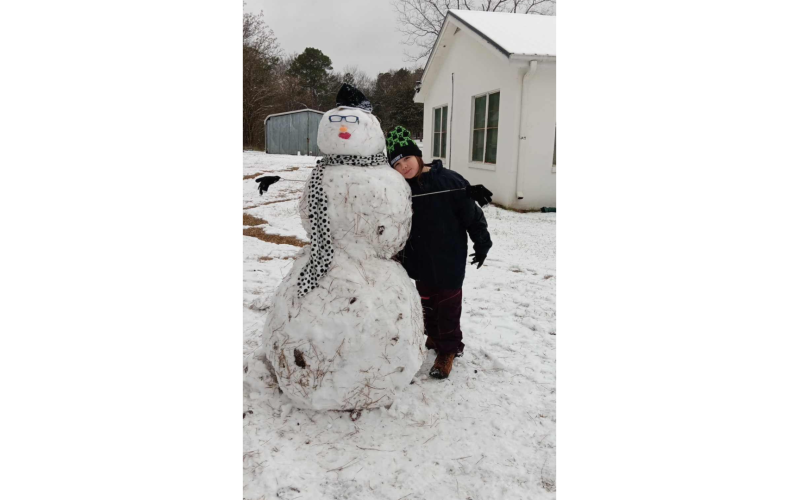 Lilyana Thompson with a life-sized snow person. (Photo submitted by Penny Thompson)
