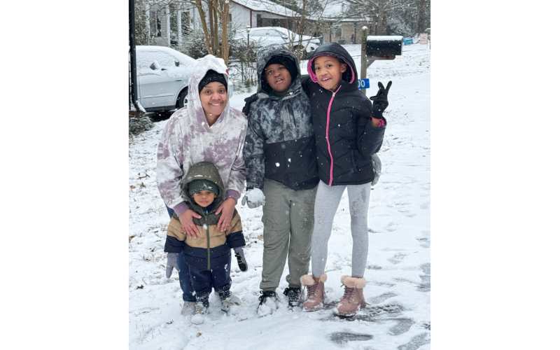 Kimberly Fortson, Royalty, Rylan  and Noah enjoyed the snow on Thomas Street. (Photo submitted by Evans)