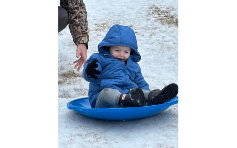 Lincoln Rousey loves his first sled in the snow. (Photo submitted by Debra Romine)