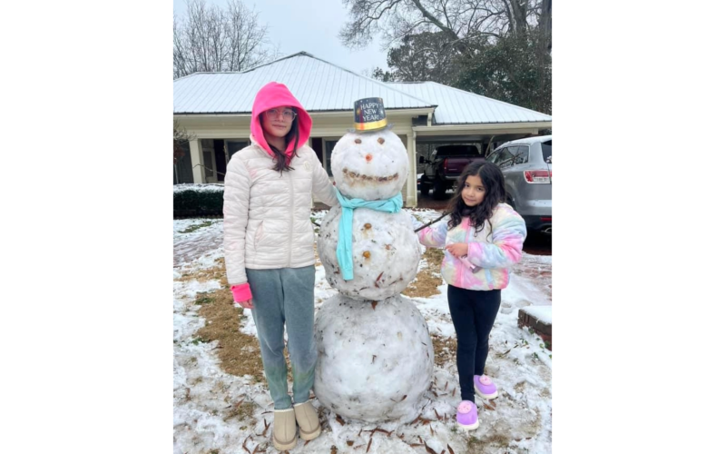 These young ladies build a New Year’s snowman. (Photo submitted by Isaac Martinez)