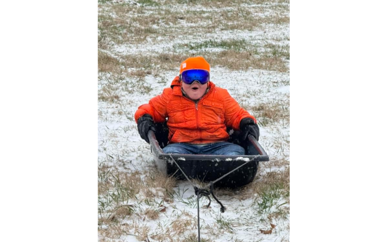 Matthew Kennedy welcomes the opportunity to sled down the hill. (Photo submitted by Bailey Webb)