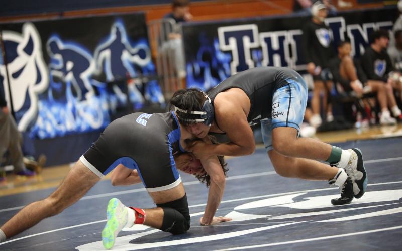 Jesus Mills circles around his opponent for better positioning during Elbert's 81-0 win over Fannin County in the first round of the area duals. (Photo by Wells)