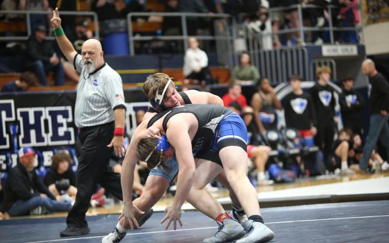 Lincoln Blackmon controls his opponents head in a grapple during Elbert's match against Fannin County in the Area 8A Championships. (Photo by Wells)