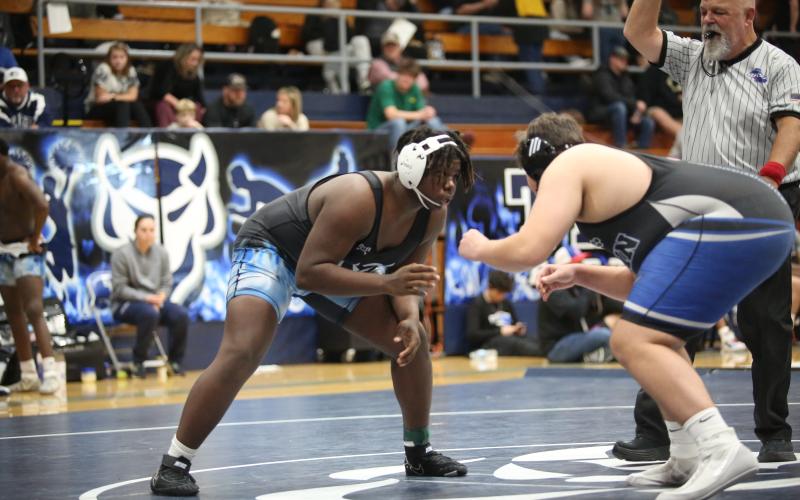 Ethan Huling circles his opponent in the ring early in his match against Fannin County Jan. 9. (Photo by Wells)
