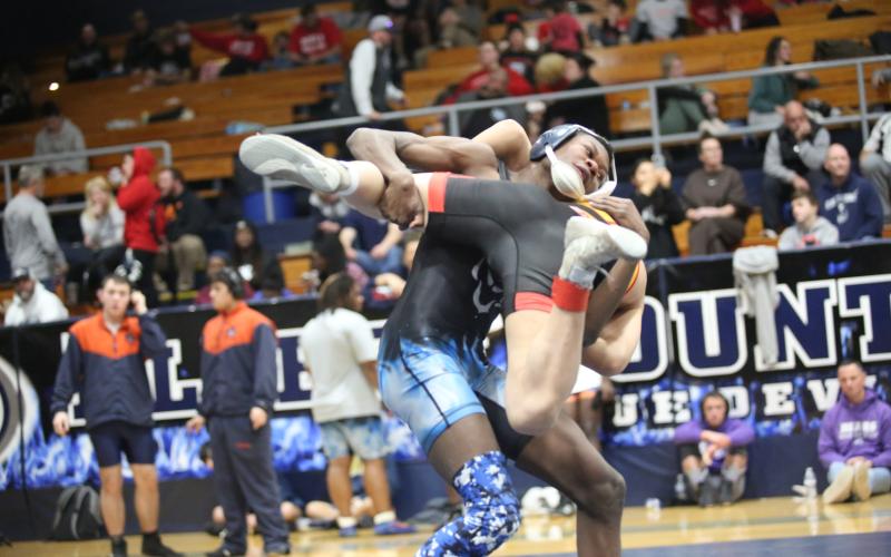 Bry Harper throws his opponent to the mat during the Inferno Invitational. (Photo by Wells)