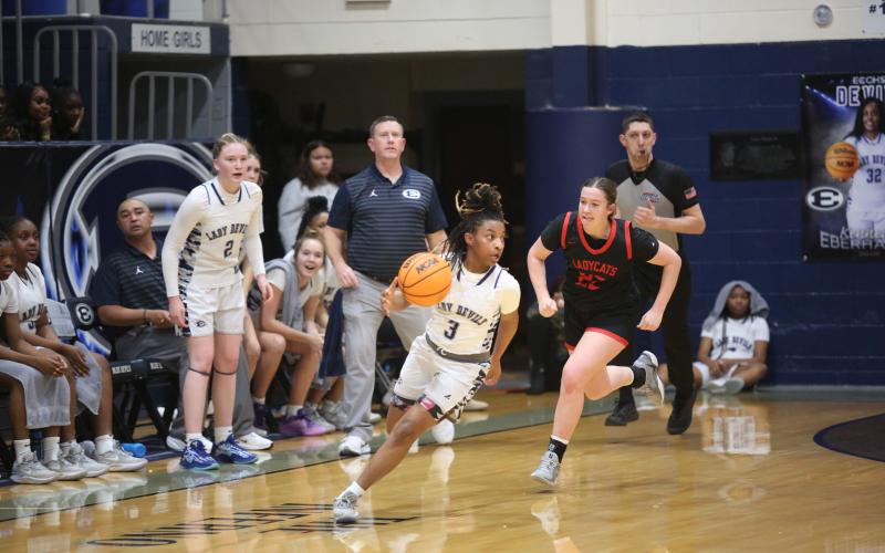 Zoe Evans moves the ball out of Rabun's end of the court while the Elbert bench looks on during the 52-41 win over Rabun Jan. 27. (Photo by Wells)