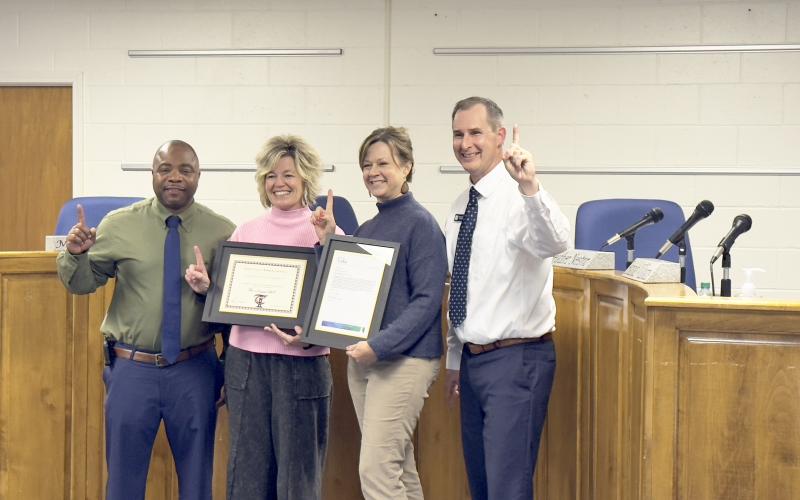 Elbert County Elementary School principal Jasper Huff, Elbert County Primary School principal Christy Hart, Paul J. Blackwell Learning Center Principal Laura Albertson and Elbert County School Superintendant Robert Wheeler celebrate being the top of the list for their recent designation as a Title I Rewards School for student achievement during Monday’s board of education meeting. (Photo by Weeks)