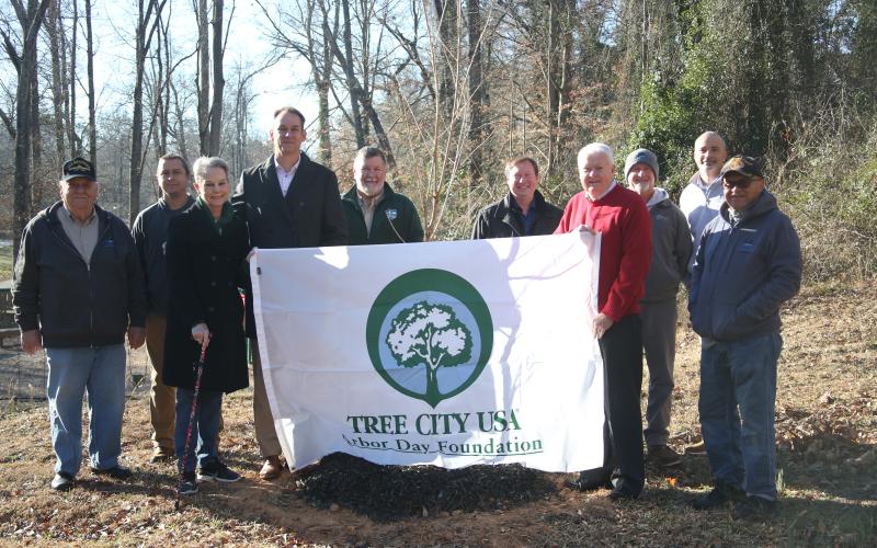 Pictured during the tree planting ceremony were (L-R) Council Members Troy Colquitt and Kyle Parham, Mary Jane Denney, Mayor Daniel Graves, Chief Ranger Wesley Moss, Council Members Rick Prince and Carey Butler, Public Works Landscaper Allen Turner, City Manager Kevin Evensong and Council Member Terry Burton.