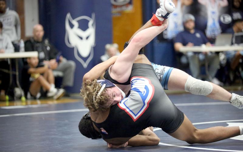 Sawyer West flips an Oglethorpe wrestler on his back during the Area 8A Traditional Championships hosted by the Mat Devils in the Inferno Feb. 1. (Photo by Wells)