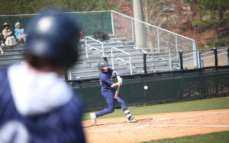 Sam Amabile gets his bat around on the ball during Elbert’s win over Athens Academy in the first game of the March 8 doubleheader. (Photo by Wells)