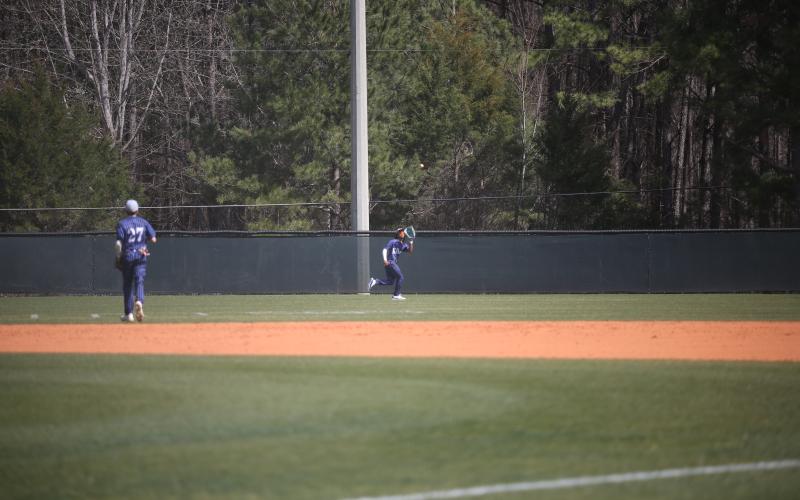 Cheyvis McLendon chases down a fly ball during one of Elbert’s wins over Athens Academy March 8. (Photo by Wells)