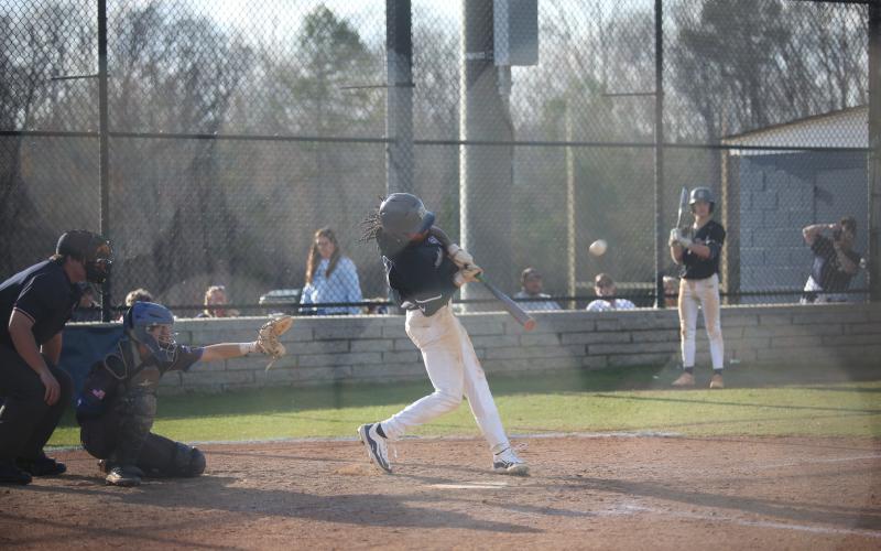 Cheyvis McLendon rips a double into the outfield during Elbert’s win in the first game of a doubleheader against Barrow Arts and Sciences Academy. (Photo by Wells)