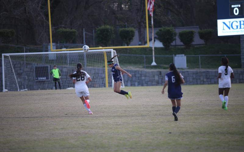 Linda Garcia leaps and heads the ball out of her own end during Elbert’s 3-2 win over Commerce March 14. (Photo by Wells)