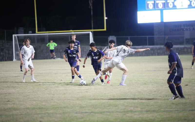 Ronny Medellin avoids a tackle from a Commerce defender and keeps the ball moving forward during Elbert’s 9-3 win over the Tigers. (Photo by Wells)