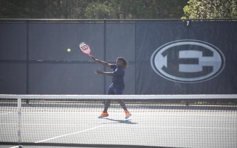 Jasean Jenkins puts topspin on the ball as he returns a shot from his opponent during Elbert’s March 19 match against Rabun County. (Photo by Wells)