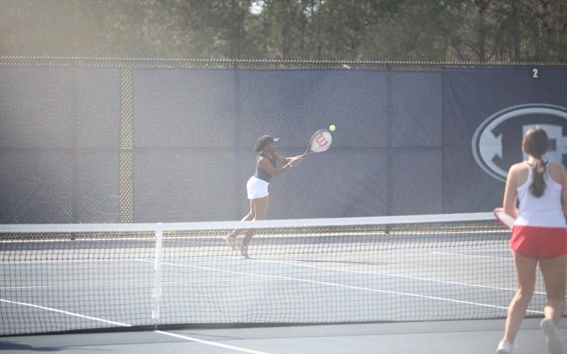 Jurnee Porter makes a reaching shot during the girls No. 1 doubles match against Rabun County March 19. (Photo by Wells)