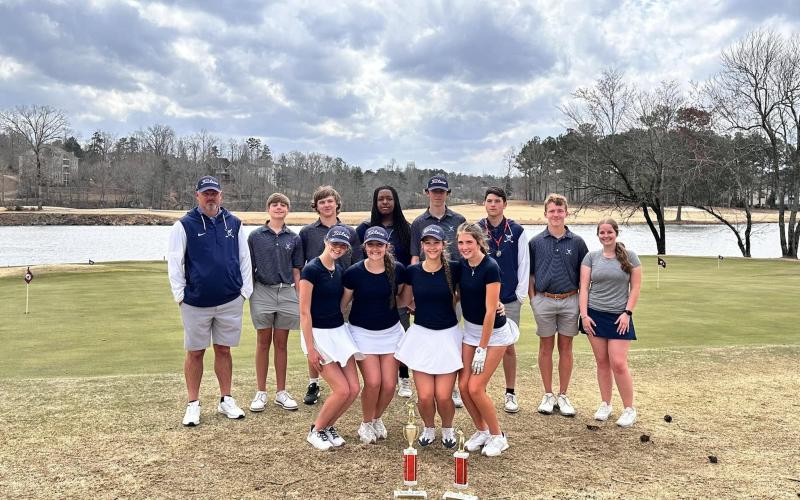The Devils and Lady Devils golf teams pose with a pair of trophies won at the Cougar Invitational in Villa Rica. (Photo courtesy of Elbert County Golf)