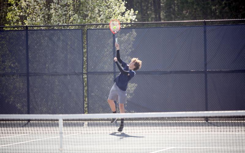 Adrian Jenkins serves the ball during a match against Washington-Wilkes. (Photo by Wells)