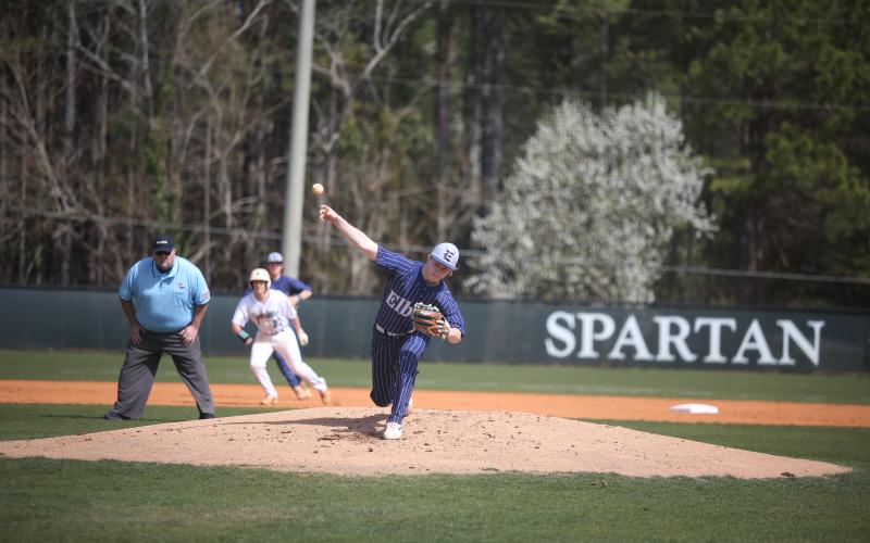 Colson Brown lets a pitch fly during Elbert’s three-game sweep of Athens Academy.  (Photo by Wells)