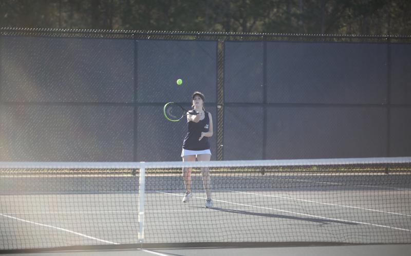 Emma Ray hits the ball with a forehand shot during a win over Washington-Wilkes. (Photo by Wells)