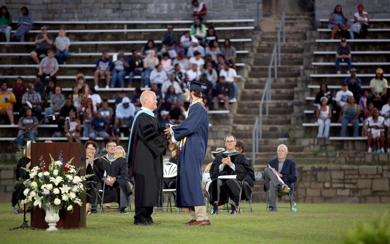 Brady Dickerson receives the Faculty Cup from ECCHS Principal Josh Rider. (Photo by Wells)