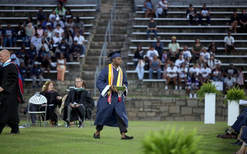 Jermaine Sims is presented with the Principal's Cup by ECCHS Principal Josh Rider. (Photo by Wells)