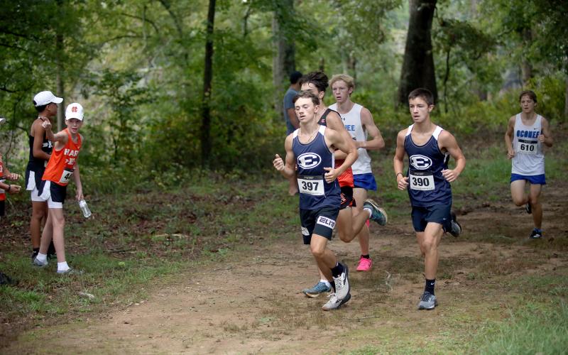 Dakota Toole (left) and Eli Alexander (right) led the Devils in their most recent cross country meet hosted by East Jackson. (File photo by Bo Underwood)