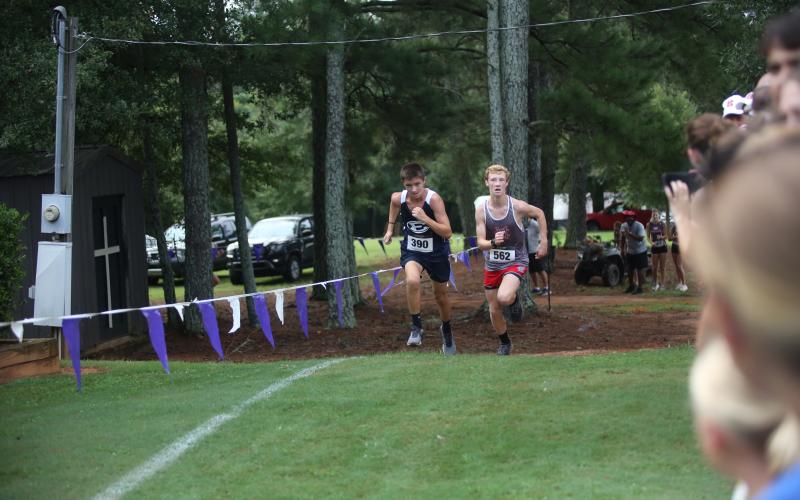 Eli Alexander (left) was Elbert’s top finisher at the Northeast Georgia Cross Country Championships Aug. 16. (Photo by Bo Underwood)