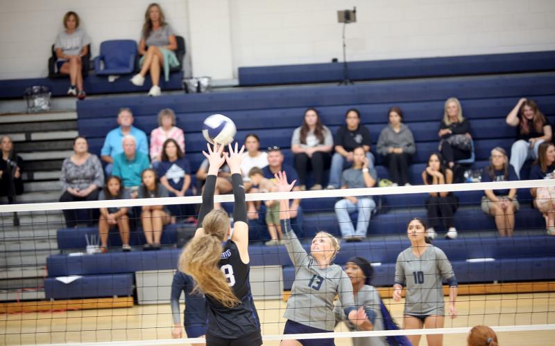 Cadence Noggle (13) rises up for a block in Elbert’s match against Banks County on Sept. 11. (Photo by Bo  Underwood)