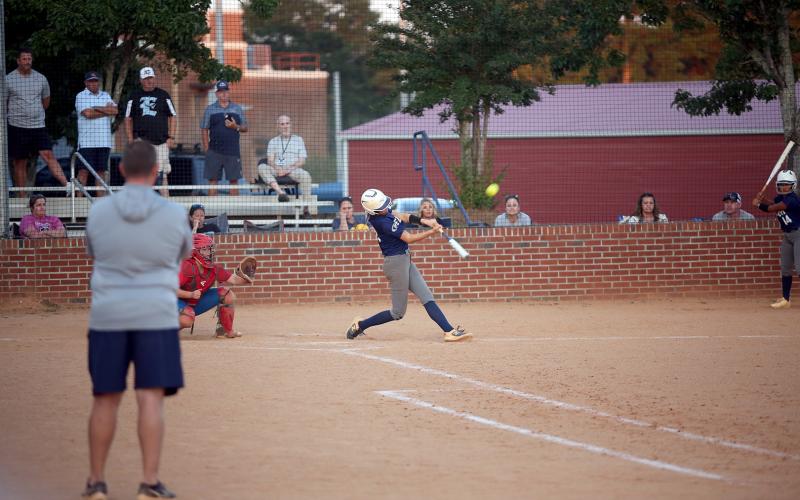 Bryleigh Dickerson hits her second of two home runs during Elbert County’s 15-0 win over Oglethorpe. (Photo by Bo Underwood)