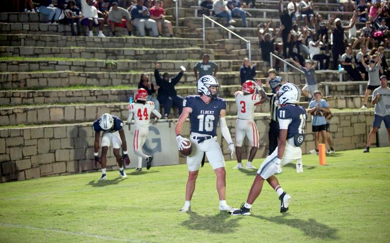 Jackson Black (16) celebrates a touchdown with Antonio Brown (11) in Elbert’s 24-17 loss to Lincoln on Sept. 12. (Photo by Bo Underwood)
