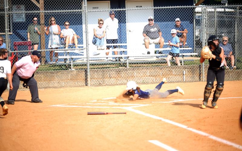 Elbert County catcher Ky Dubose slides into home plate in Elbert County’s 8-4 win over Commerce on Sept. 18. (Photo by Bo Underwood)