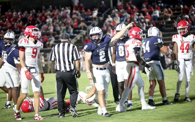 Lincoln Blackmon (2) signals a stop in Elbert’s 24-17 loss to Lincoln on Sept. 12. (Photo by Bo Underwood)