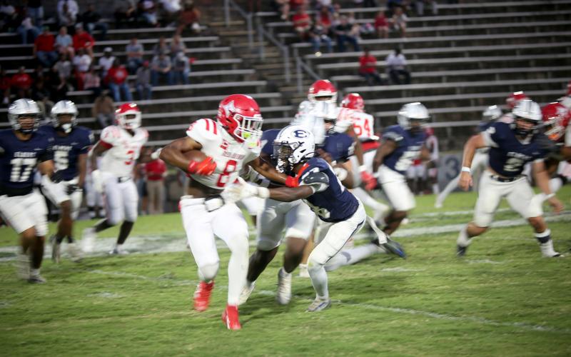 Runt Mattox (23) makes a tackle in Elbert’s 24-17 loss to Lincoln on Sept. 12. (Photo by Bo Underwood)