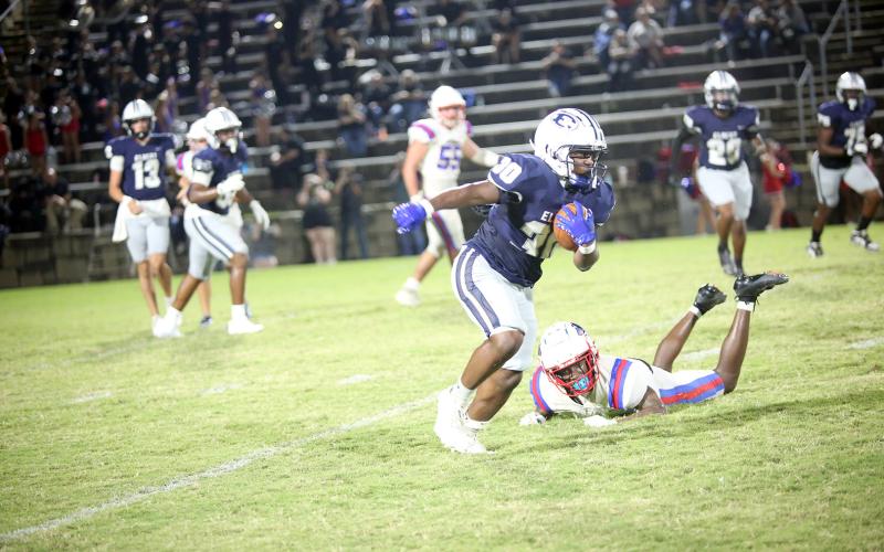 Petey Allen runs through a defender against Oglethorpe on Sept. 19. (Photo by Bo Underwood)
