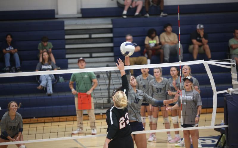 Elbert County freshman Alexa Vargas (10) hits the ball over the net during a match against Rabun County on Sept. 16. (Photo by Bo Underwood).