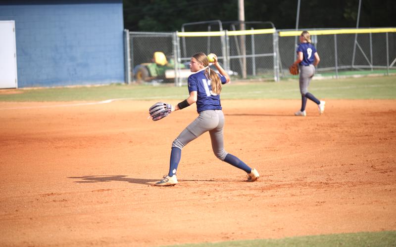 Bryleigh Dickerson throws the ball to first base. (Photo by Bo Underwood)
