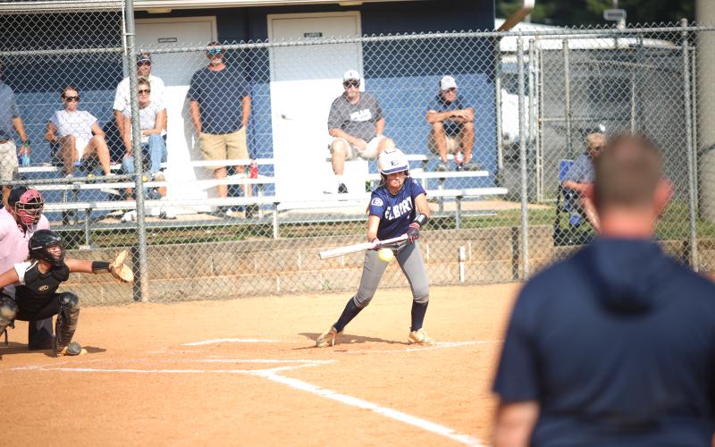 Peyton Jenkins attempts a bunt against Commerce. (Photo by Bo Underwood)