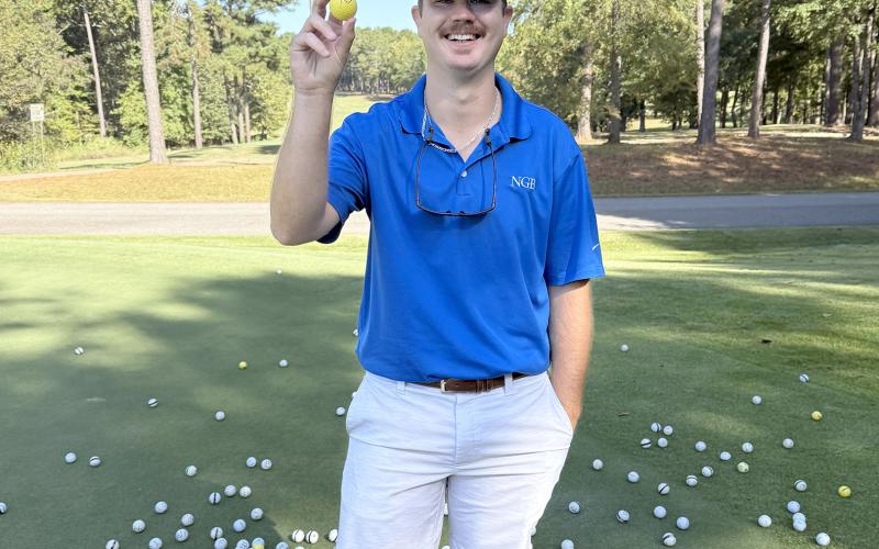 Tournament volunteer Colton Moon pulled Jason Floyd's golf ball during the annual golf ball drop, making Floyd the winner of the $500 grand prize.